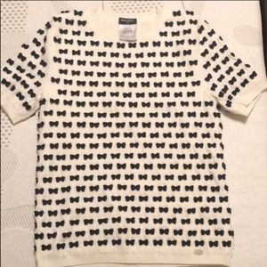 Chanel top with black bows.